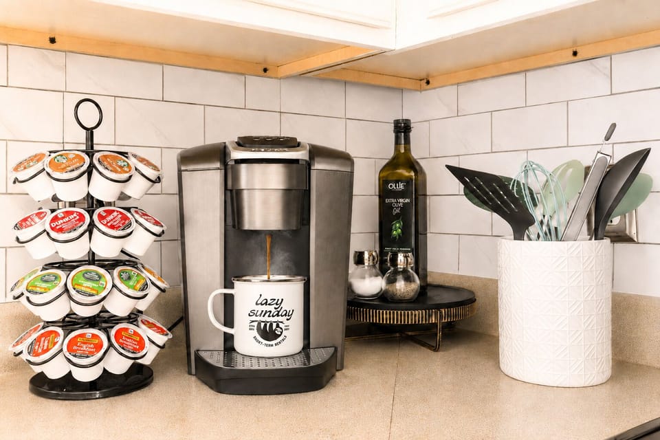 Convenient coffee station with pod variety and a clean, modern kitchen setup