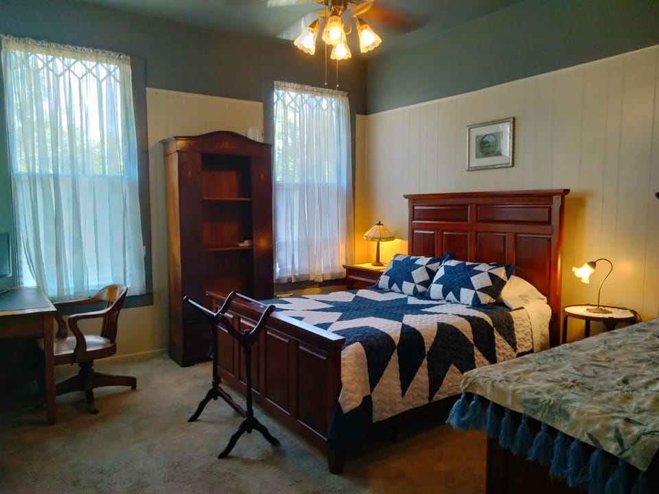 Bedroom #2 with queen bed, desk and TV