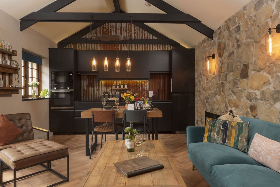 The Old Dairy, Carnhell Green, Hayle: Complete with exposed stone walls, vaulted ceilings, rustic tin sheeting and exposed roof trusses.