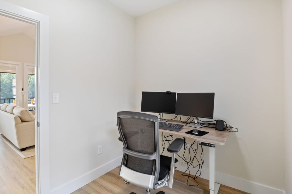 Dedicated workspace with dual monitors, ergonomic chair, and USB-C Laptop Dock. Ideal for remote work while enjoying your lake retreat.