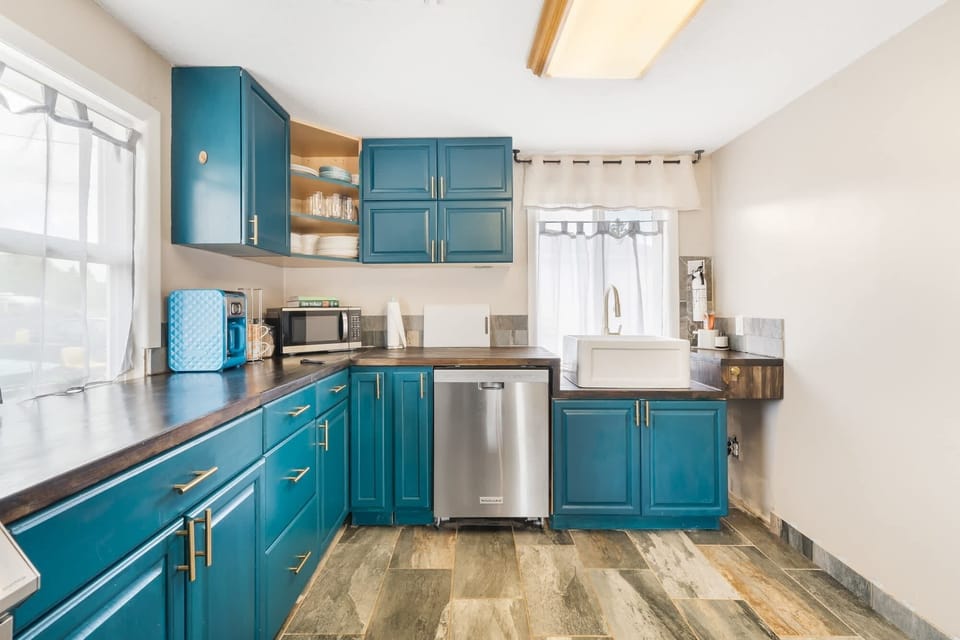 Step into the heart of the home. Our recently remodeled kitchen is accented with a fun bohemian flair, seamlessly blending modern convenience with charming mid-century style.