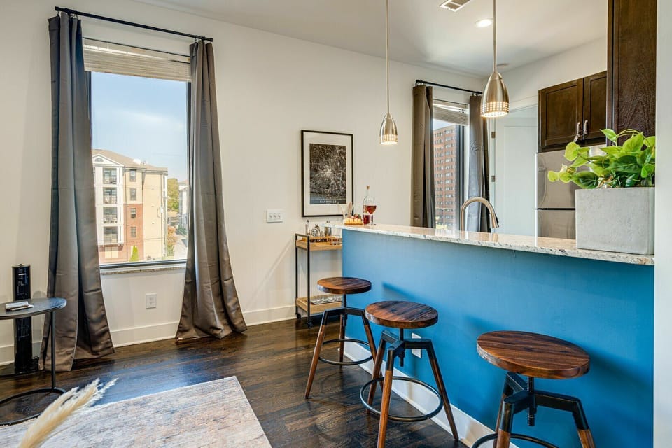 Unit 1: Fully equipped kitchen stocked with basic cooking essentials and complete with bar seating.