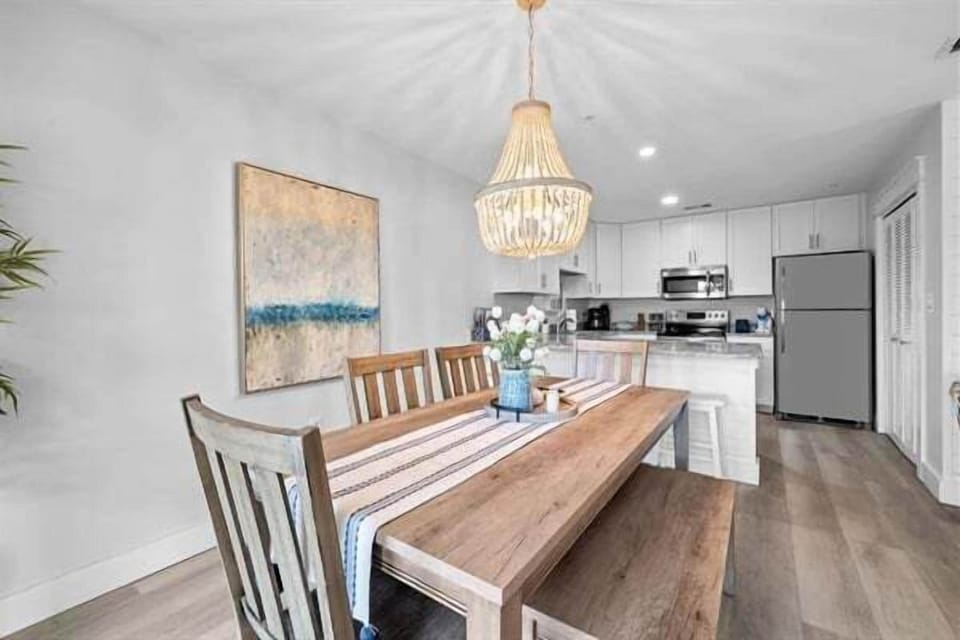 Gather around this elegant wooden dining table for memorable meals.