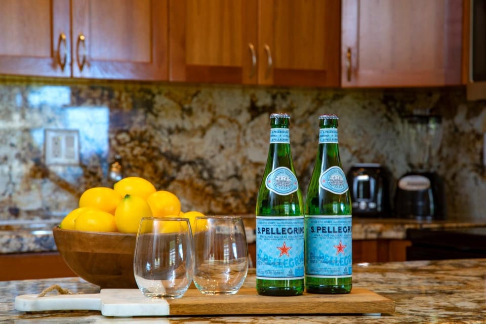  Bright countertops, citrus bursts, and bubbly Pellegrino make for a refreshing welcome home   
