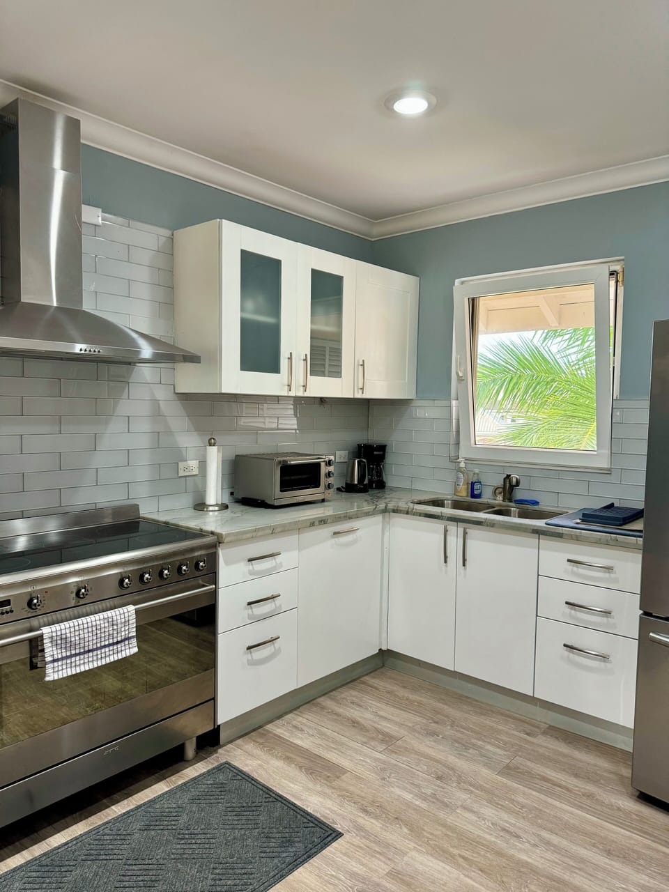 Kitchen with full size appliances, dishwasher.