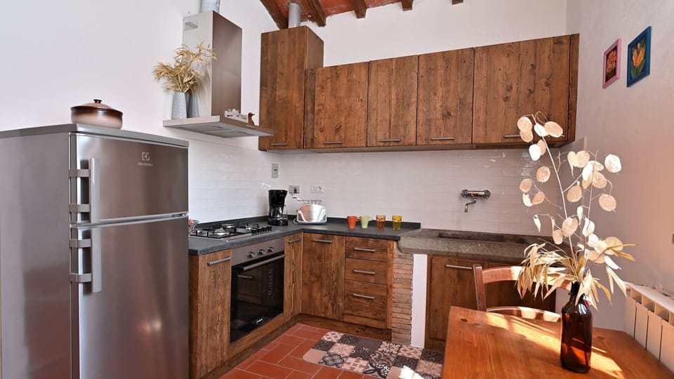 Brown, Cabinetry, Property, Countertop, Wood, Kitchen, Kitchen Stove, Interior Design, Lighting, Flooring