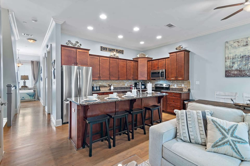  Cook and entertain in the fully equipped kitchen with a large island and seating.