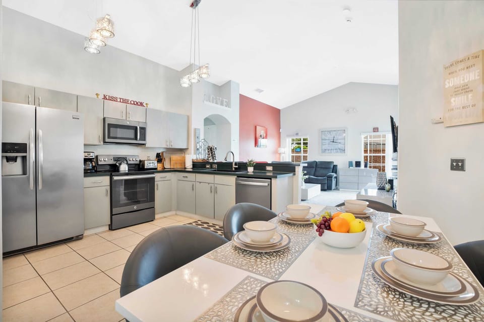 Modern kitchen with stainless steel appliances and an open dining area for family meals.