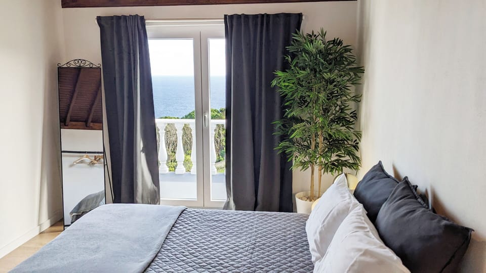 Room1 w/ Queen-size bed and Balcony, Open Sea, Garden and Swimming Poll View.