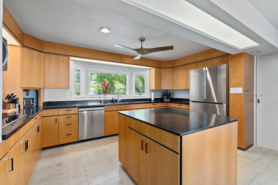The chef-ready kitchen is equipped with Viking appliances, dual ovens, and plenty of prep space for group meals.