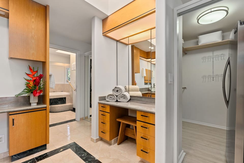 Studio ensuite bath with vanity and walk-in shower—perfect for added privacy.