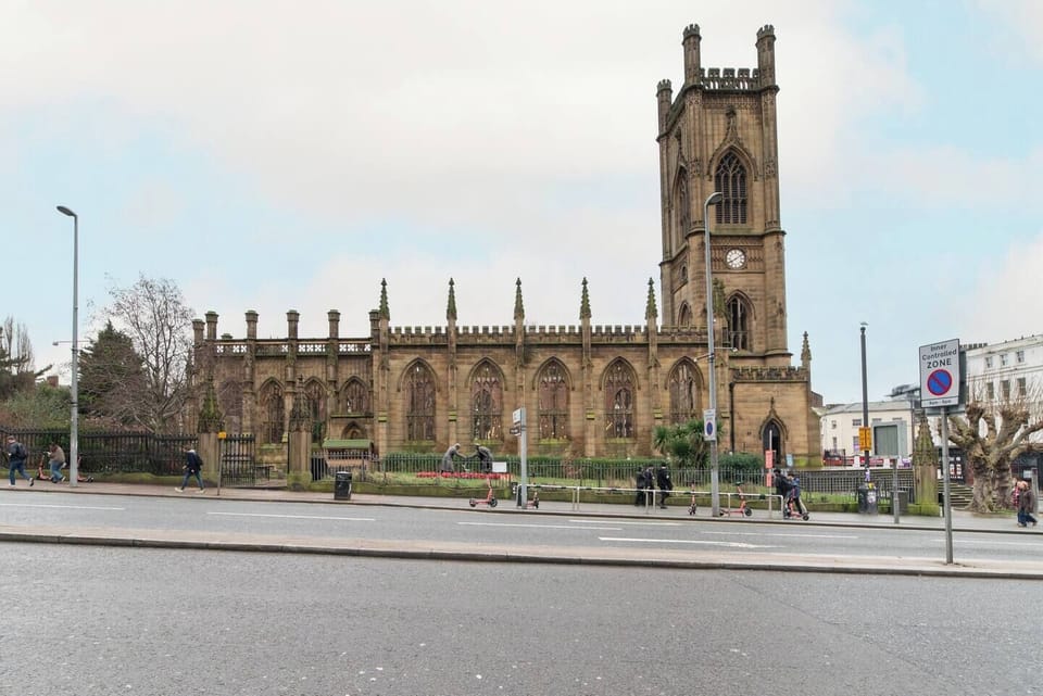 Enjoy stunning views of Liverpool’s iconic Bombed Out Church—a landmark backdrop that captures the city’s unique charm and history right from your window.
