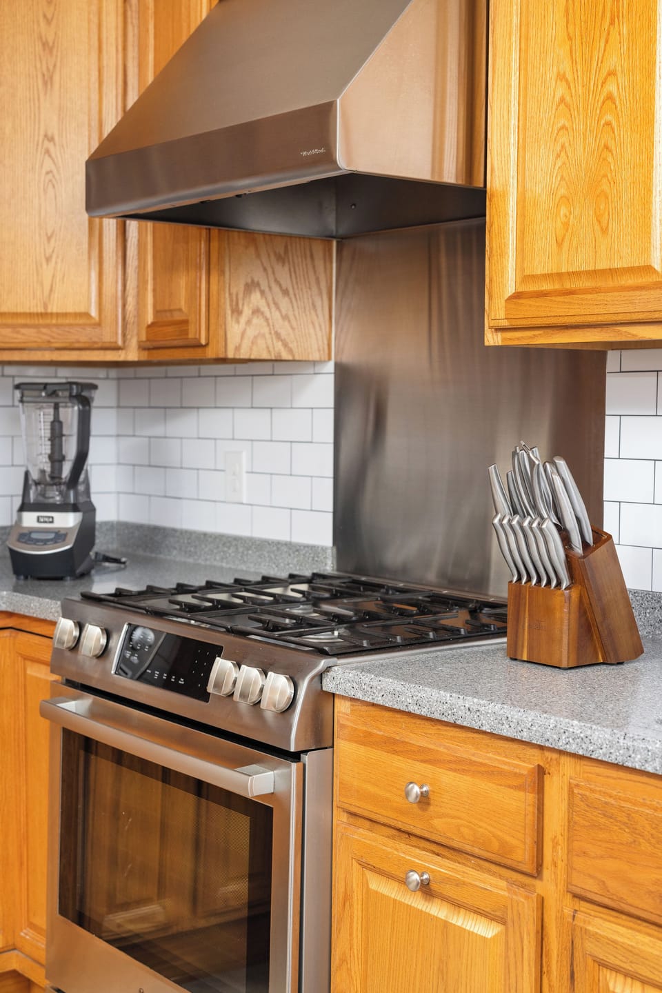 Kitchen with SS fridge, Gas Stove/Oven and Dishwasher. Extra Fridge in Laundry  