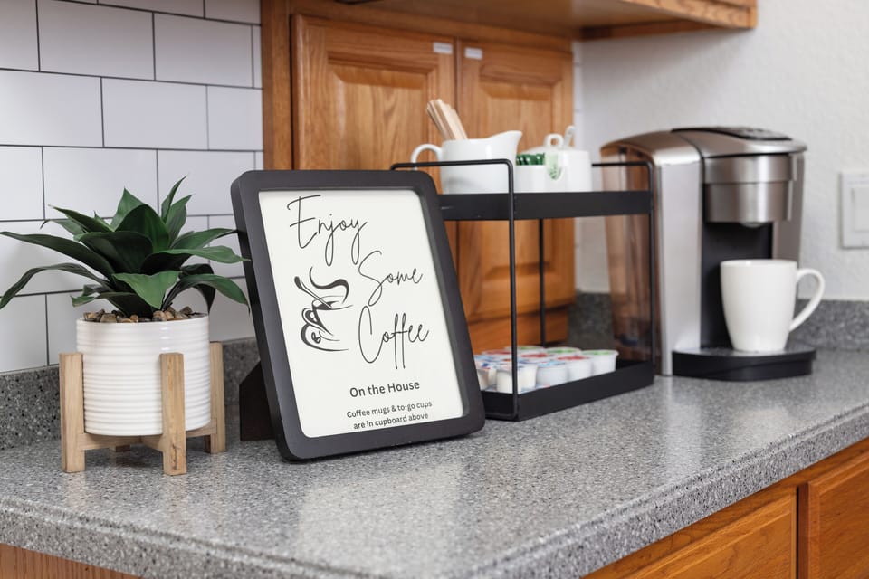 Keurig w/ pods, creamer, and diff sweeteners. Mini  ground coffee pot w liners. 