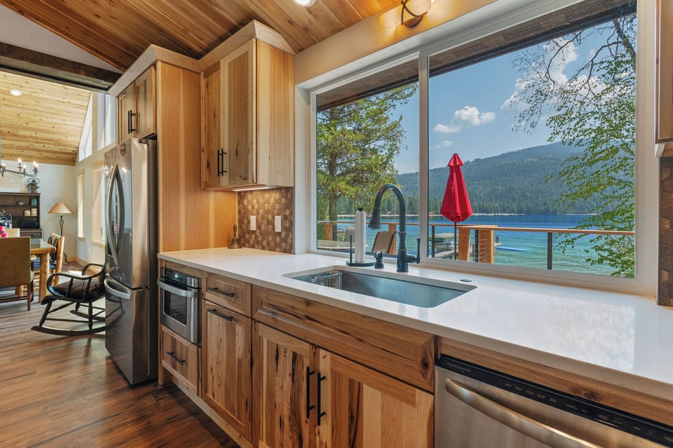 Doing dishes is a serene experience. Pass through window w outdoor shelf.