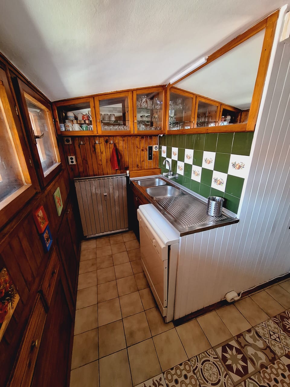 The washing corner in the kitchen - two-basin sink & dishwasher, wooden cabinets