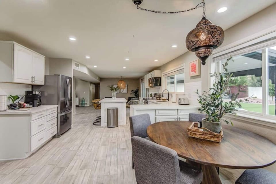 The eat-in kitchen offers a table for 4. Guests can also enjoy our coffee bar with Nespresso machine and Cuisinart drip coffee maker. We start off guests with Nespresso pods, ground coffee, tea, creamer and sugar.