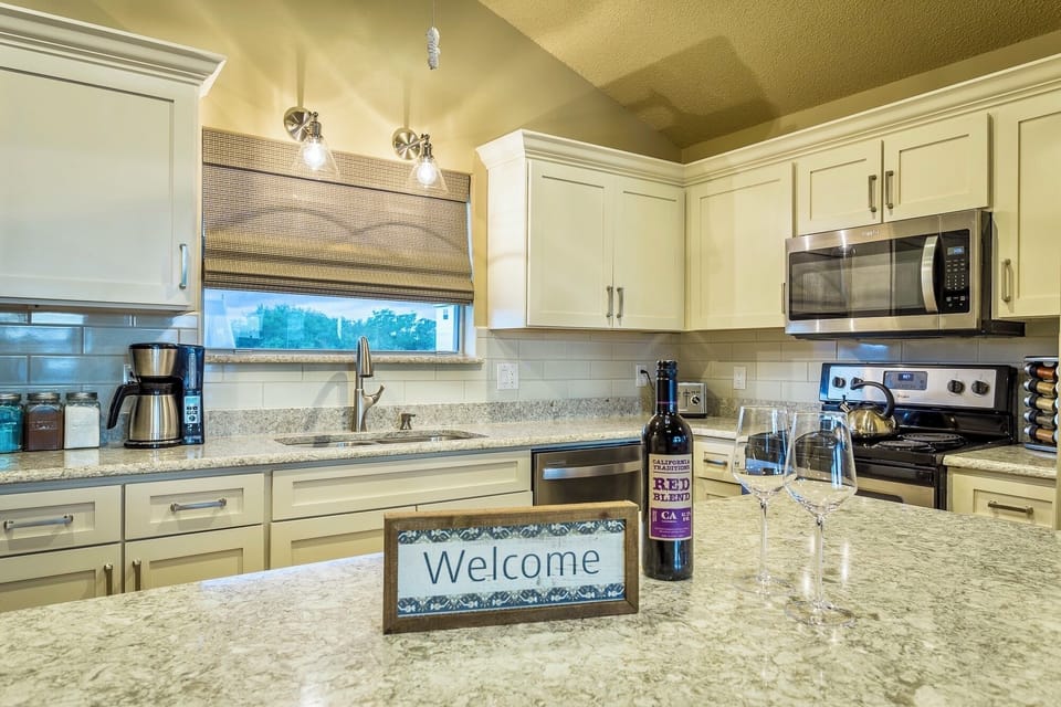 Kitchen is open to dining area & living room w/ cathedral ceilings & ocean views