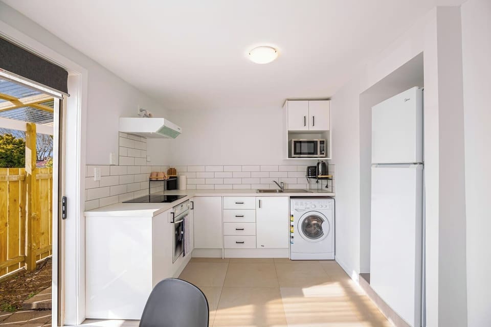 The kitchen has everything you need to create meals including a cook top, oven, microwave, and toaster.