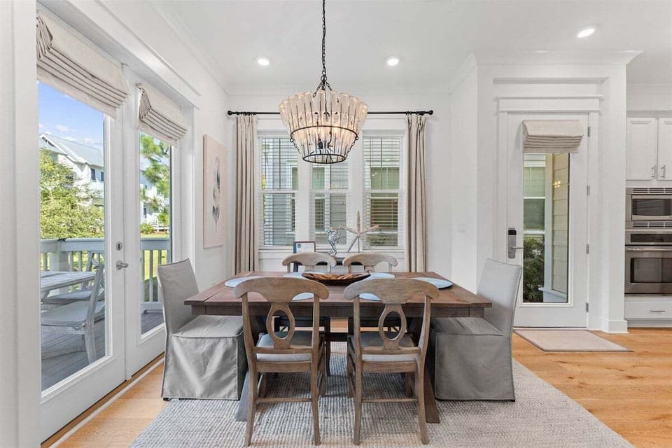 A beautifully designed dining space with a modern coastal aesthetic.