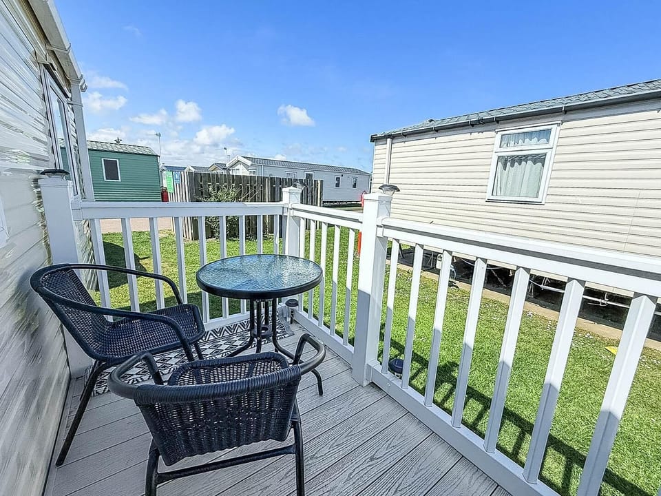 This outdoor space extends your living area, offering a wonderful place to enjoy a morning coffee