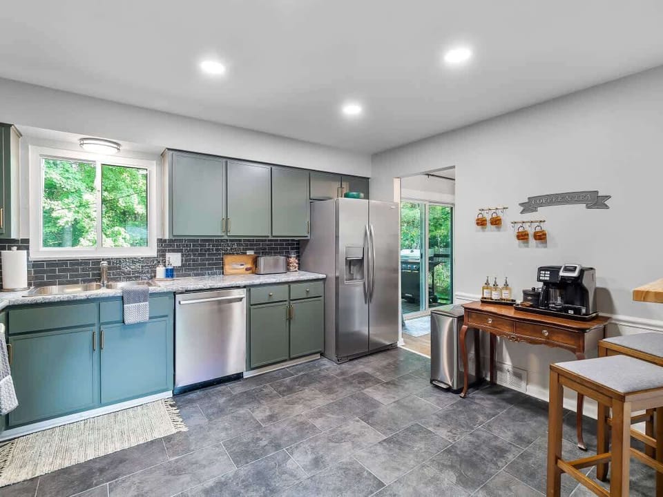 Bright kitchen w/ long counters, window light & functional layout