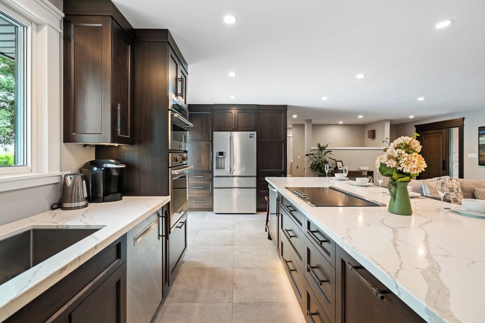 Full Custom Kitchen featuring Induction Cook Top and Open Concept Island seating