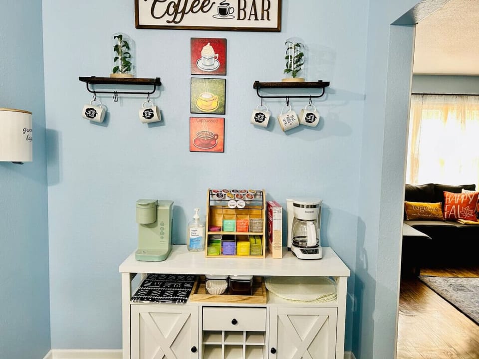 **Well-stocked coffee & tea nook.** Enjoy complimentary coffee, tea, and creamer in a dedicated station—an easy, thoughtful touch to start or end your day comfortably.