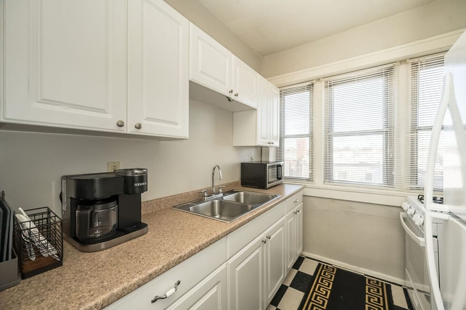 A modern kitchen stocked with everything you need to whip up a great meal.!