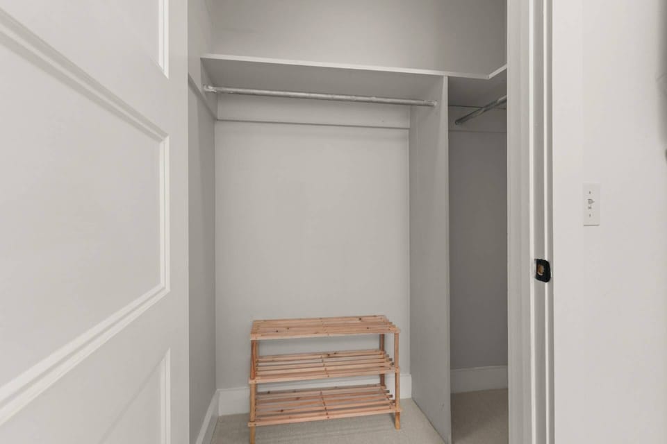 There is plenty of room to store all of your hanging clothes and luggage in this spacious closet in bedroom #1.