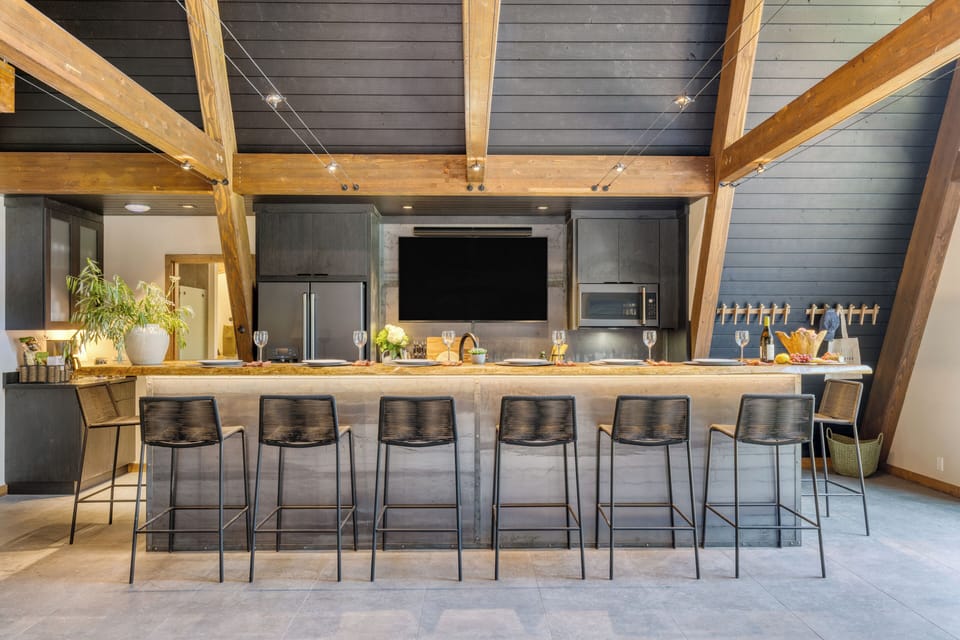 Kitchen features a large island with barstool seating.