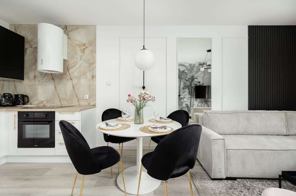 The living room's modern and stylish decor creates a welcoming atmosphere. 