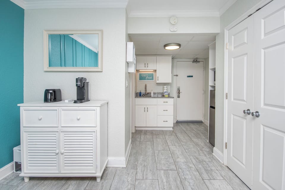 Kitchenette with toaster, Keurig coffee maker, mini-fridge, microwave, dishes