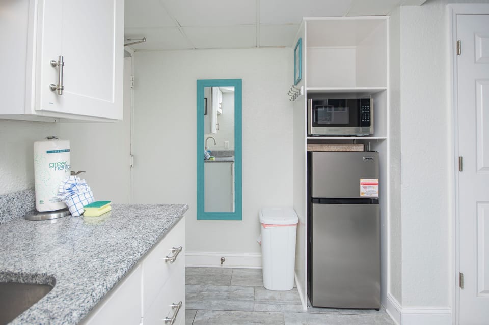 Kitchenette includes toaster, Keurig coffee maker, fridge, microwave, & dishes
