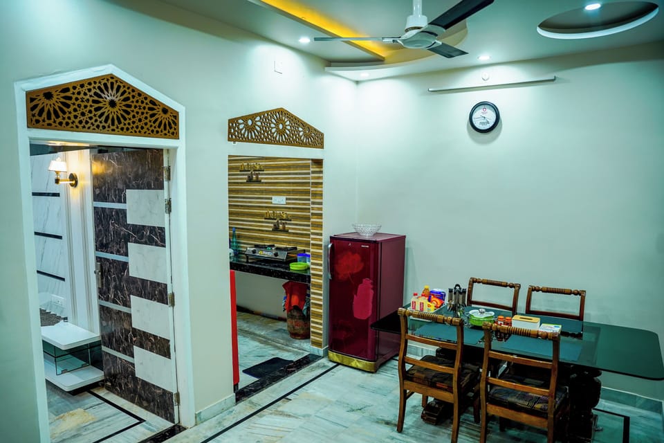 dinning area, guest can access fridge.