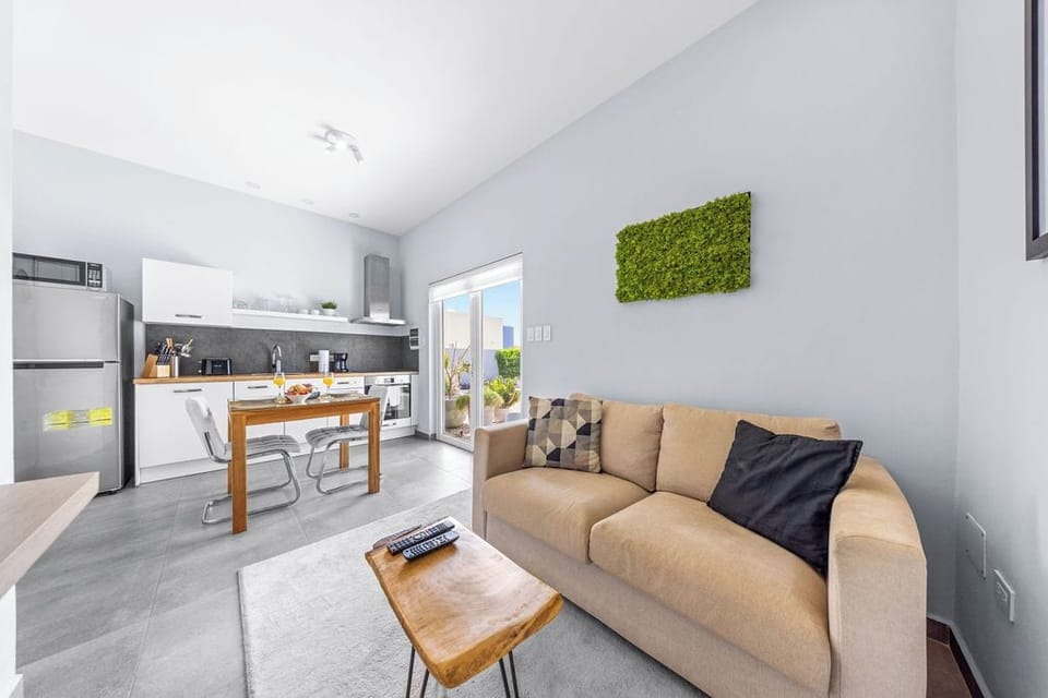 Kick back and relax in this inviting living space—cool, comfortable, and perfect for movie nights.
