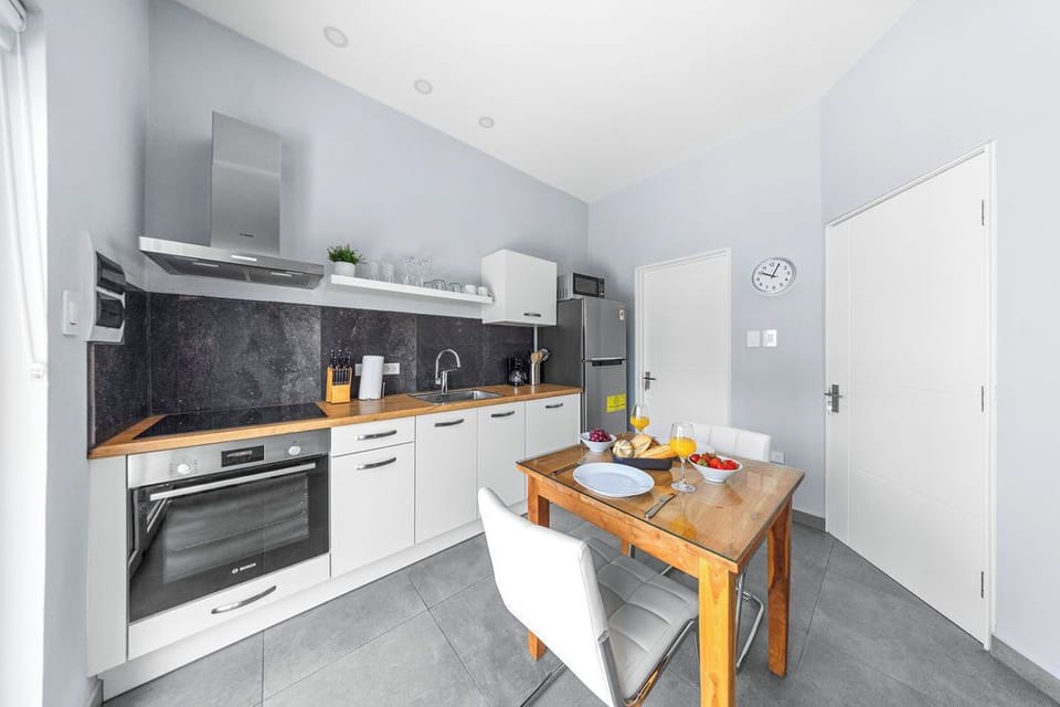 Cook and dine in style in this charming kitchen with a perfect setup for two.
