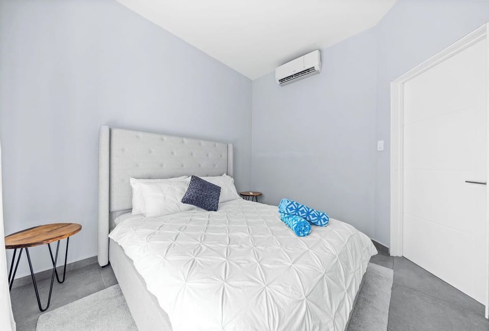 Sleep soundly in this inviting queen bed, where comfort meets charm.
