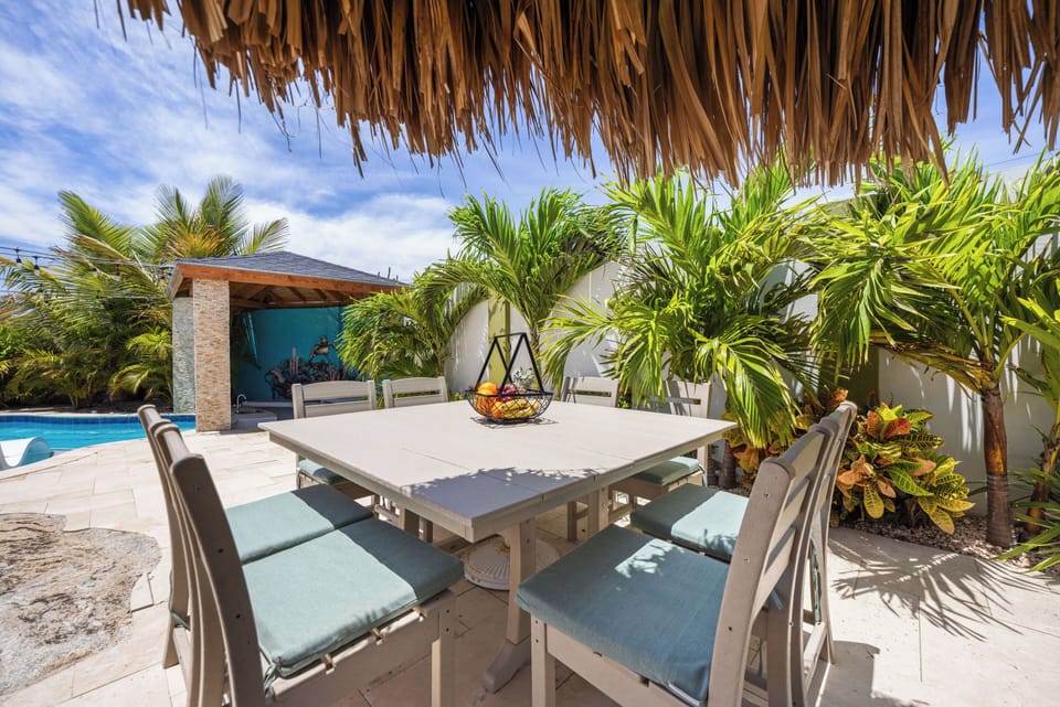 Enjoy al fresco dining under the shade of a tropical palapa
