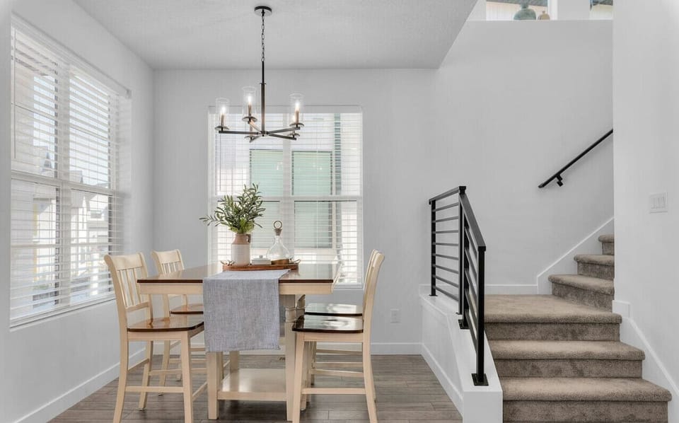 The open dining area seamlessly blends into a minimalist dining area