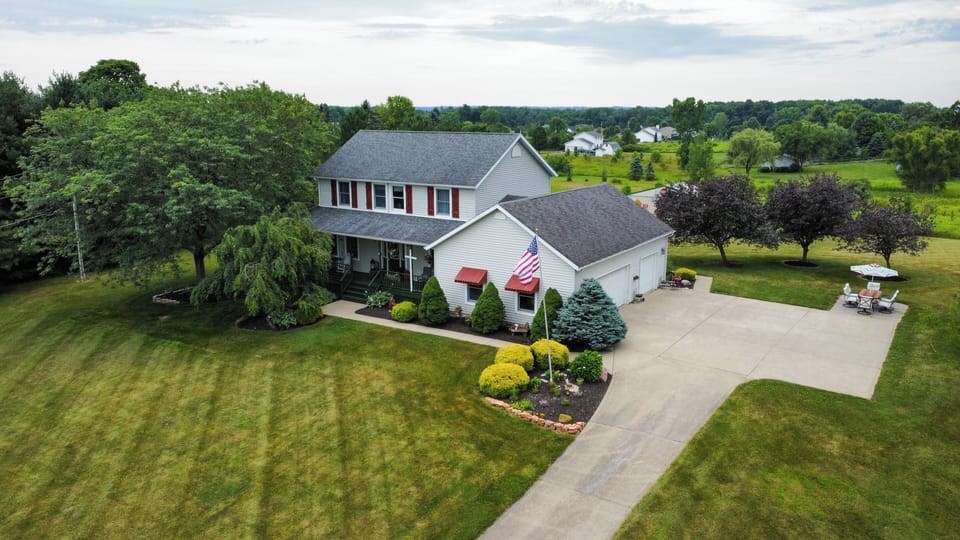 Spacious 3 Car Garage & Plenty Of Parking For Trailers Or RV.