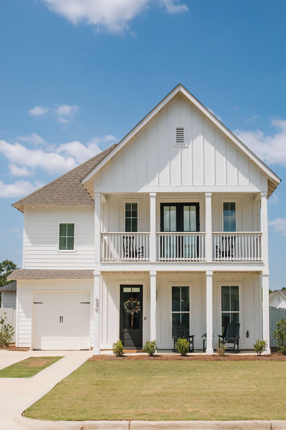 Welcome to The Aubie House—a charming two-story retreat with a cozy front porch and upstairs balcony, both featuring rocking chairs. Perfect for morning coffee or evening breezes, it’s a warm, peaceful getaway.