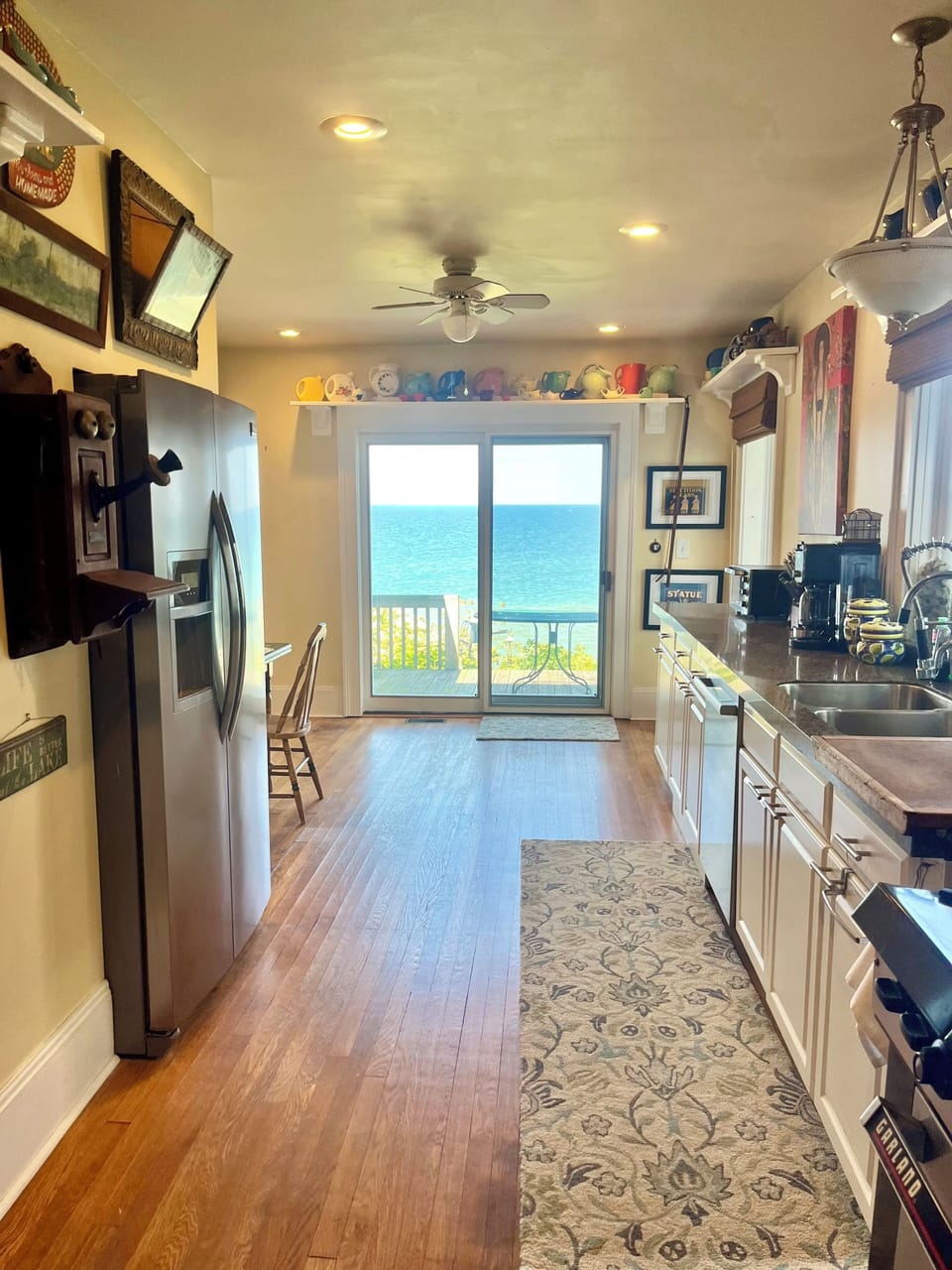 Kitchen slider and back deck overlooks Lake Erie. Eat b’fast & dinner lakeside!