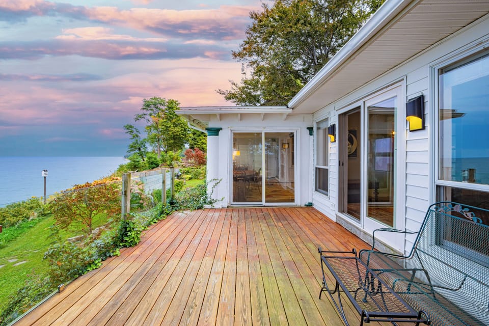Main Deck. Accessed from the primary bedroom and the sunroom sliders.