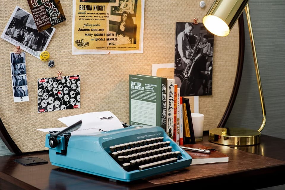 Get inspired at the vintage typewriter desk under warm light.