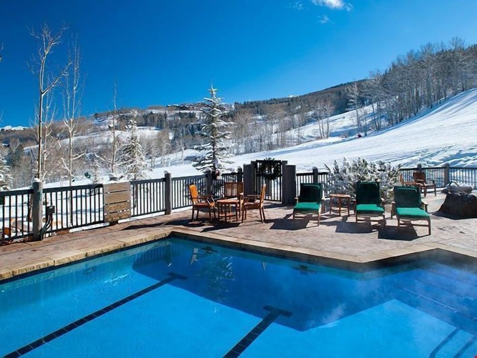 Take a dip in the large outdoor swimming pool.