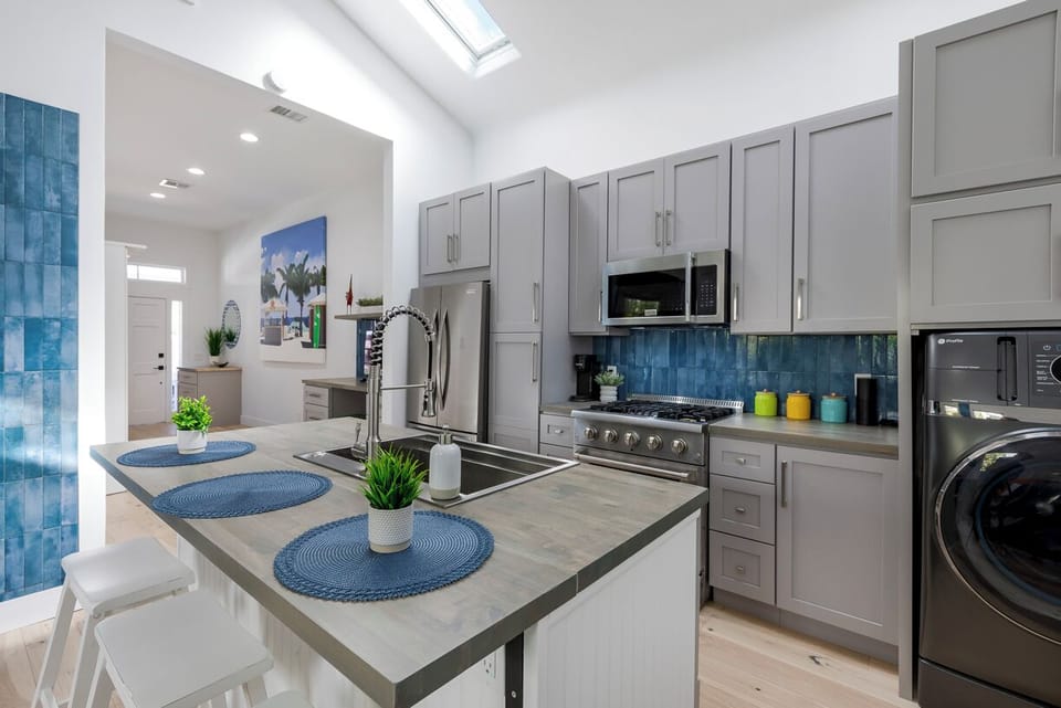 fully stocked brand new kitchen and laundry