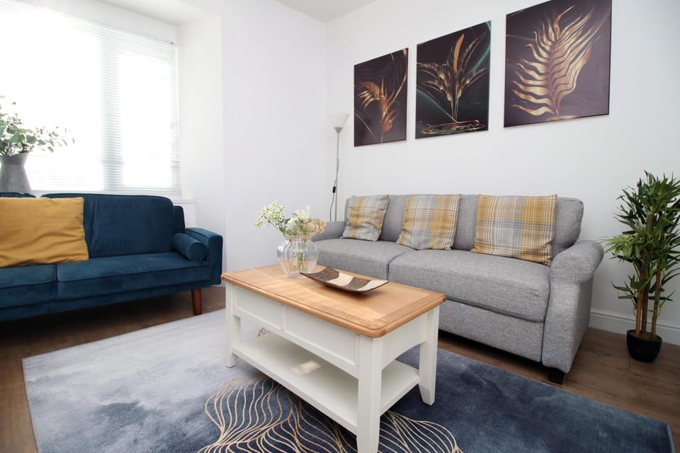 Whether you're catching up on work, spending a quiet evening in, or sharing the space with a loved one, the relaxed atmosphere and stylish touches make this living area a truly welcoming spot.