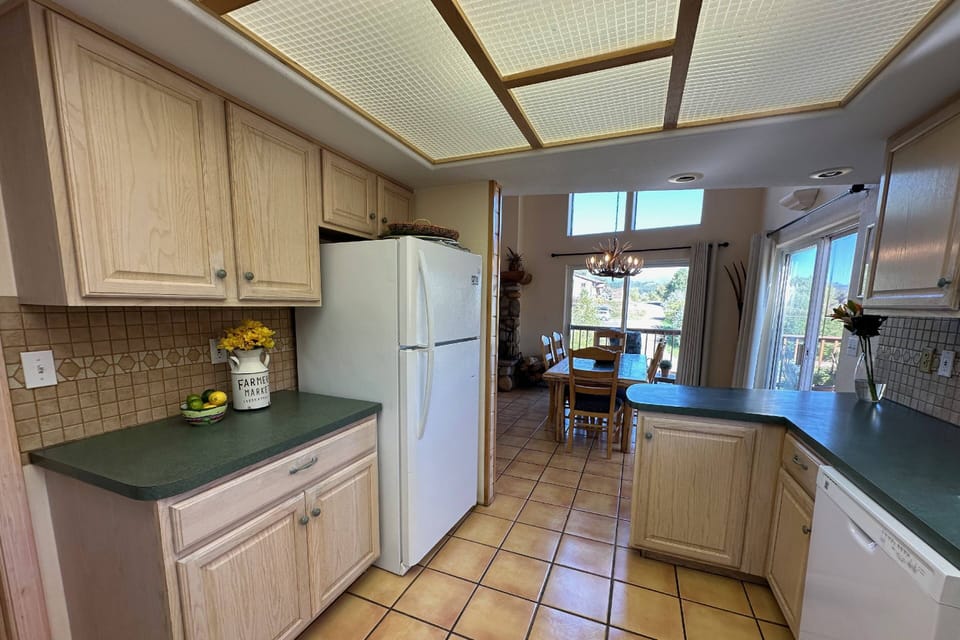 Beautiful views and easy access to the upper-level gas grill make cooking a breeze in the Creekside Cabin(s). Guests love this large downtown home.