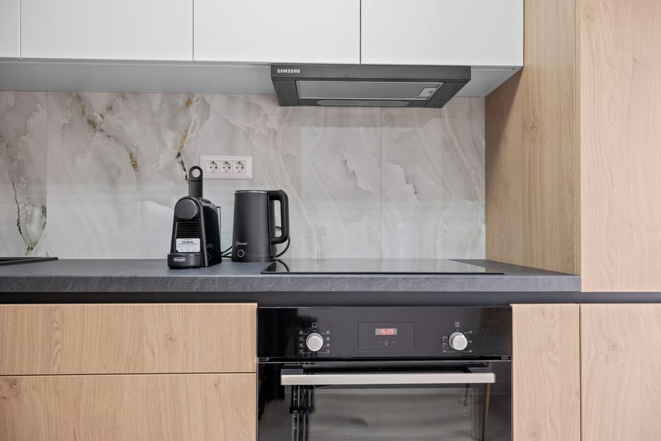 kitchen coffee tea water fridge microwave oven dining table 